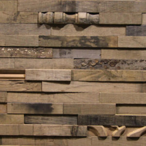 A wood panel, made from small rectangular wood strips. These wood strips are organized on a horizontal layout, and sometimes a piece with unusual patterns that resemble antique wood details shows. The tonality of the wood is light-to-medium brown.