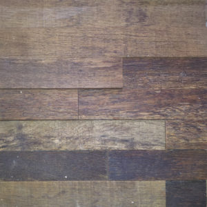 Horizontal wood strips, arranged in a pattern. Each strip has a different height and different tonalities, creating an interesting tridimensional environment.