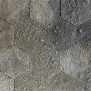 A recycled hexagonal surface with different earths and sediments.