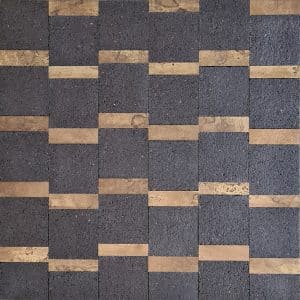 This design is composed of cork bits and pine wood bits, placed in various layouts. The contrast between the light shade of wood and the dark one in the cork places each strip perfectly, creating a vibrating and tactile environment where textures take a visually striking space.